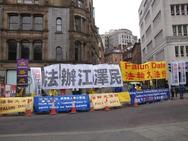 Falun Gong practitioners hold peaceful petition beside Manchester town hall on October 23, 2015.