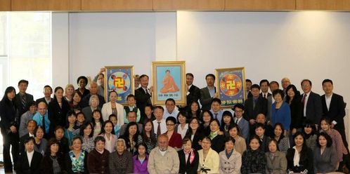 A group of attendees pose for a photo after the conference.