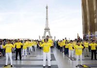 Group exercises in front of the Eiffel Tower on May 8, 2016