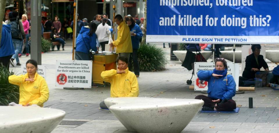Demonstrating the Falun Gong exercises in downtown, Perth, Australia, on June 11.