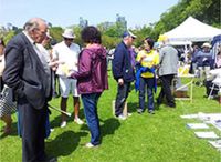 An Italian gentleman (with the stick) learned Falun Gong many years ago, but stopped for various reasons. He was glad to run into practitioners today so that he could resume practicing.