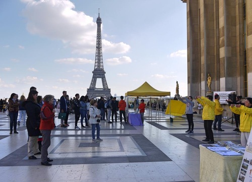 Practitioners demonstrate the Falun Gong exercises on Human Rights Square in Paris, France.