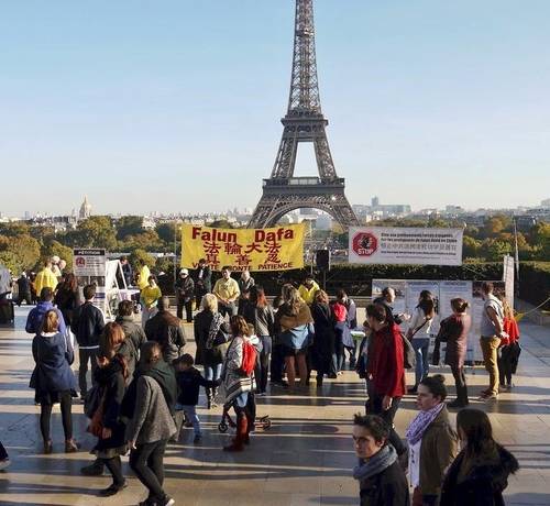 Falun Dafa community even near the Eiffell Tower in Paris, Falun Dafa practitioners sharing and providing information on the persecution of Falun Dafa in China.