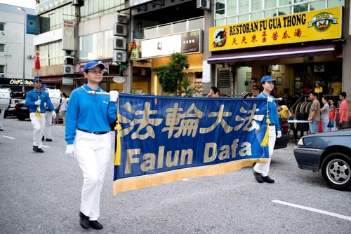 eea6ee411c4d505eba9b39eaeddb6020 Parade in commercial district of Subang Jaya, Selangor.