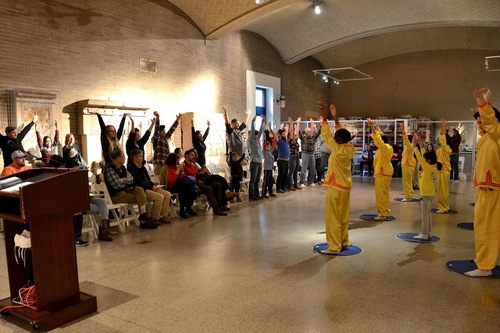 Audience learn the exercises on the spot at the University of Pennsylvania Museum.