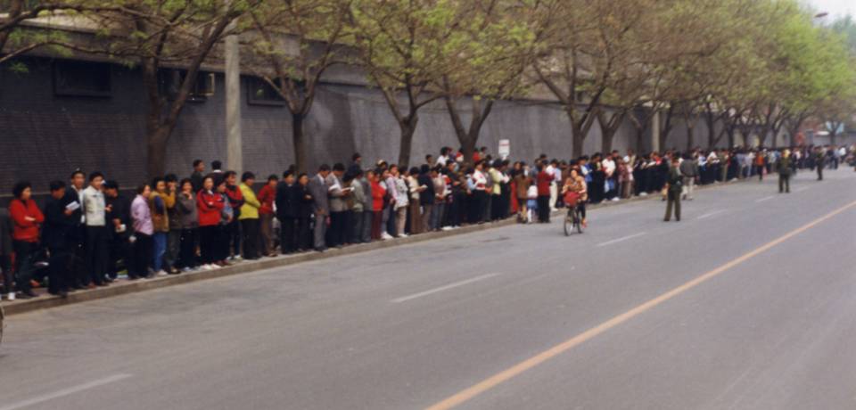 Falun Gong practitioners standing on the sidewalk at the west side of Fuyou Street, Zhongnanhai, Beijing.