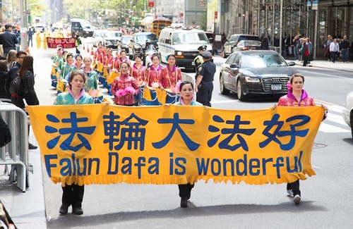 Practitioners from different cultures held a march in New York City on May 12 to celebrate the 18th annual World Falun Dafa Day.