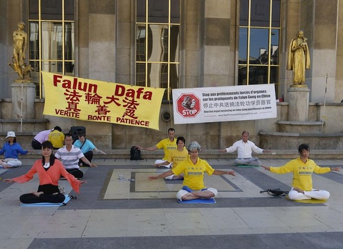 Falun Gong practitioners sit in meditation.
