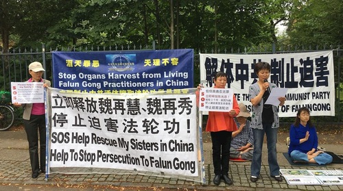 Wei Zaiqun spoke at an event in front of Chinese Embassy on July 27, 2017, one day before her brother-in-law Chen died in a prison hospital.