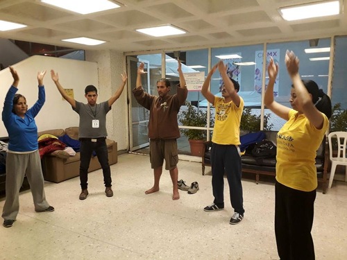 Learning the Falun Gong exercises in an earthquake shelter.
