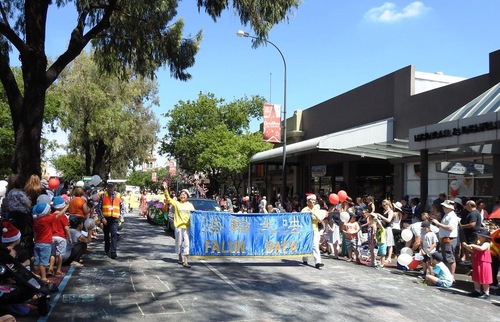 Falun Gong practitioners perform in the Christmas parade in Norwood, Adelaide.