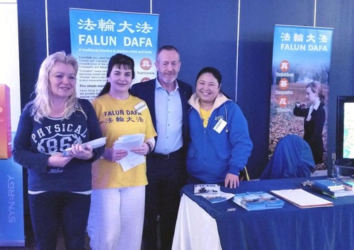 Sean Kelly, Member of European Parliament, at the Falun Gong booth at Balance Expo.