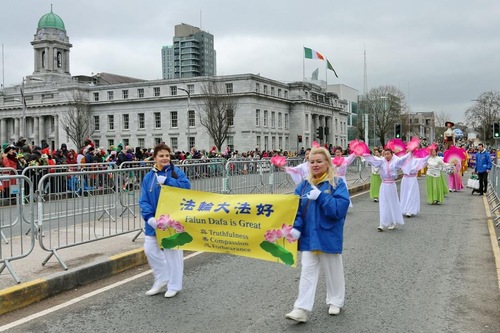 Falun Dafa practitioners take part in the St. Patrick's Day Parade in Cork on March 17, 2018.