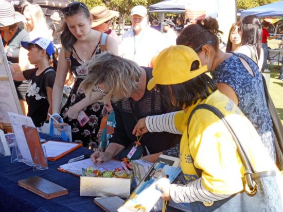 Many visitors and passerby who visited the Falun Dafa stall signed the petition to stop the persecution in China.