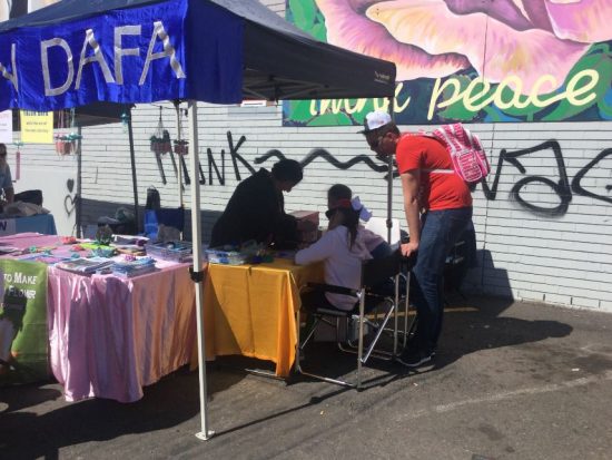 Lotus Flower making at the Falun Dafa stall.