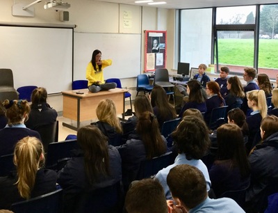 Falun Gong Practitioner demonstrating the exercises to students at the Bloomfield Community School.