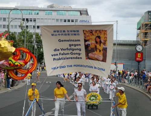 Falun Gong practitioners hold a march in Berlin on August 10, 2019 to raise awareness of the persecution in China.