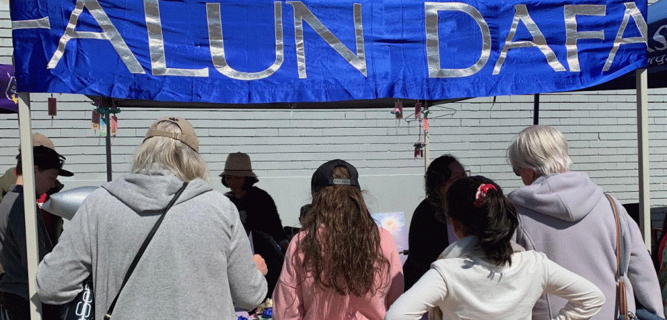 Falun Dafa stall at Spring into Corrimal, 8th September 2019.