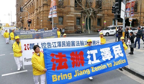 Falun Gong practitioners march in Sydney on September 7, 2018, calling for Jiang Zemin to be brought justice.