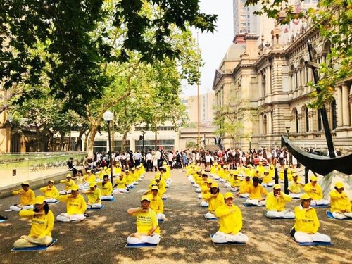 b60f100a7a36f40c9611d15d1b216676 Practitioners demonstrated the sitting meditation exercise on Human Rights Day, Tuesday, December 10, 2019.
