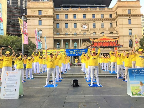Practitioners demonstrate the Falun Gong exercises in front of the historic Customs House in downtown Sydney.
