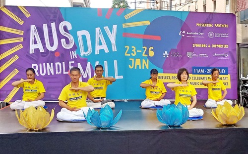 Falun Gong practitioners demonstrate the exercises on an outdoor stage in Rundle Mall, a pedestrian street mall in Adelaide.