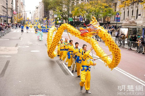 Falun Dafa practitioners participate in the 102nd annual New York City Veterans Day Parade on November 11, 2021.