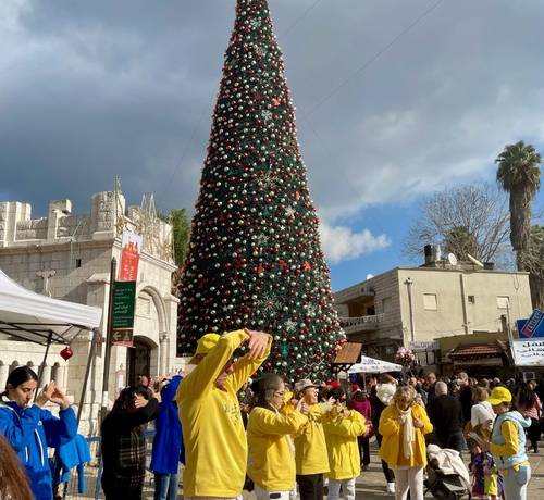 Practitioners doing the exercises in front of the Orthodox Church in Nazareth.