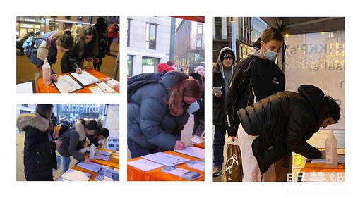 Passersby sign the petition calling for an end to the persecution of Falun Dafa in China.