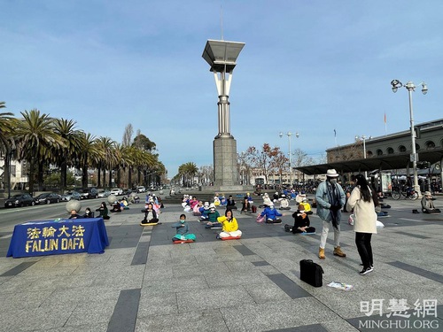 Falun Dafa practitioners demonstrate the exercises near the San Francisco Ferry Building.
