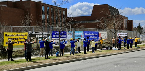 Practicing the Falun Dafa exercises in front of the Chinese Embassy in Ottawa on April 22, 2022.