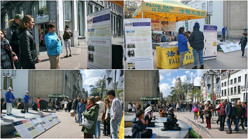Practitioners tell passersby about Falun Dafa in Antwerp’s City Center on April 9, 2022.