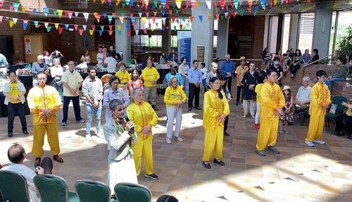 Practitioners demonstrate the exercises during the Asian Heritage Month celebration.