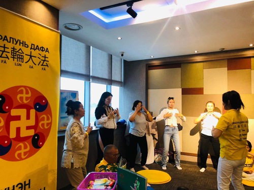 Learning to do the exercises at the health fair in Mongolia.