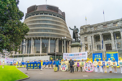 Practitioners rally in front of the Parliament Building in Wellington, New Zealand, on July 27.