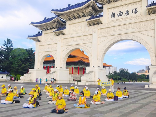 Practitioners demonstrate the exercises during a day-long event at Liberty Square in Taipei, Taiwan, on August 13.
