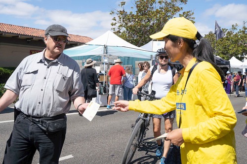 Practitioners distribute informational flyers at the Freemont Festival.