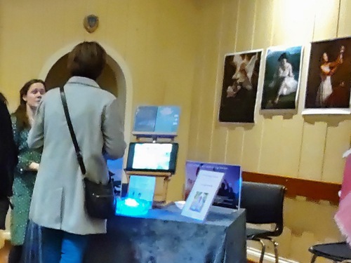 A visitor learns about Falun Gong.