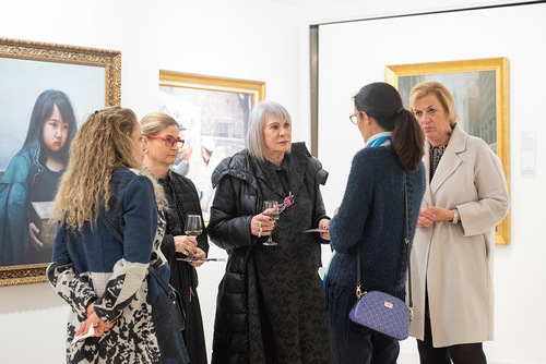 Visitors view the artworks displayed at the Truthfulness-Compassion-Forbearance International Art Exhibition, December 15-23, 2022.