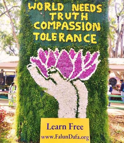 Practitioners displayed a mural with the words: “The World needs Truth, Compassion and Tolerance”