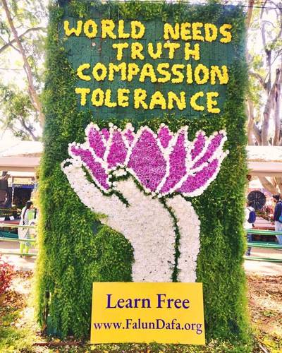 Practitioners displayed a mural with the words: “The World needs Truth, Compassion and Tolerance”