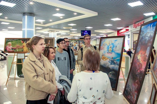 Local residents and tourists admire the art while listening to the story behind each piece.