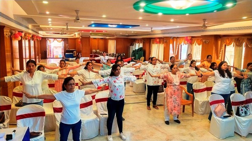 The women learn the first Falun Dafa exercise.