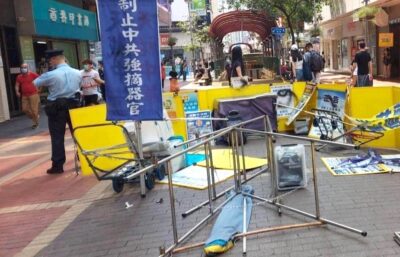 Damaged Falun Gong informational booths are seen in Hong Kong in 2021 after being attacked by pro-communist man Hu Aimin. (Image: via Faluninfo.net)