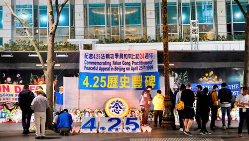 Falun Dafa practitioners hold a candlelight vigil in Melbourne on the evening of April 25, 2023.