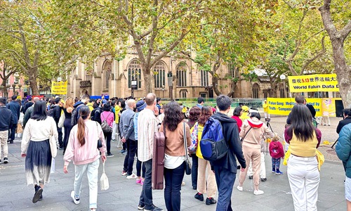 The practitioners’ performances attract many spectators at Sydneys Town Hall Square.