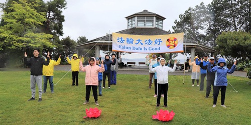 Practitioners do the Falun Dafa exercises in Marina Park.