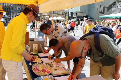 People sign the petition to end the persecution.