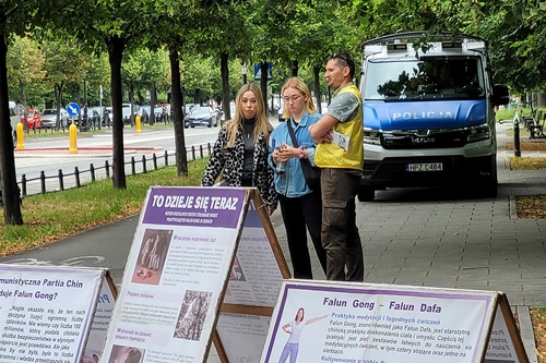 Talking to passersby about the persecution.