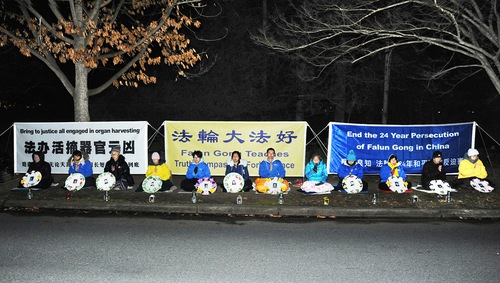 Practitioners hold a candlelight vigil in front of the Chinese Embassy in Canberra on July 20, 2023.